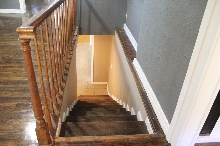 Stairs with wood finished floors and baseboards Stairs with wood finished floors and baseboards