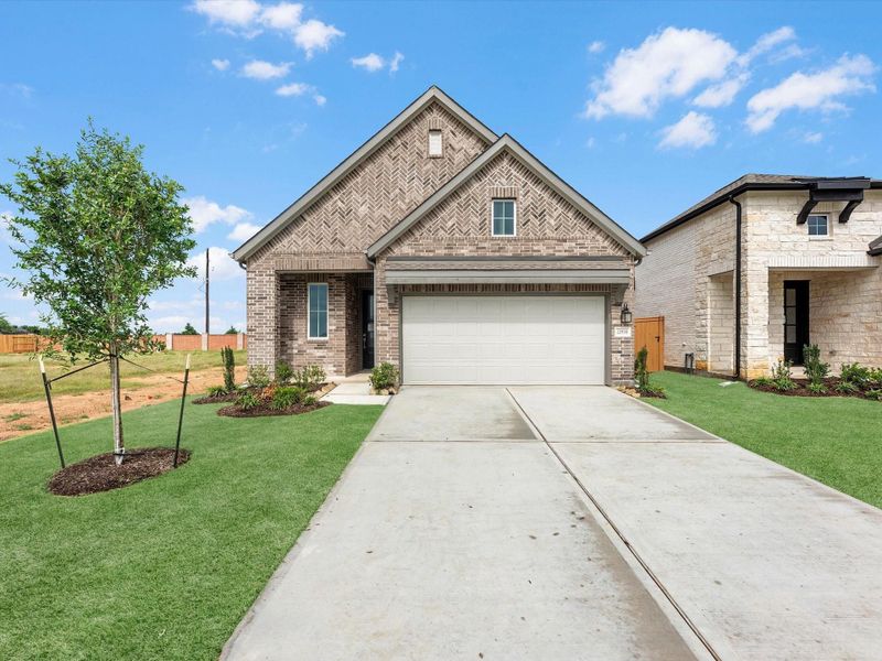 Front exterior of a new home in Wildrye, Waller, TX, highlighting curb appeal (Image 2). Front exterior of a new home in Wildrye, Waller, TX, highlighting curb appeal (Image 2).