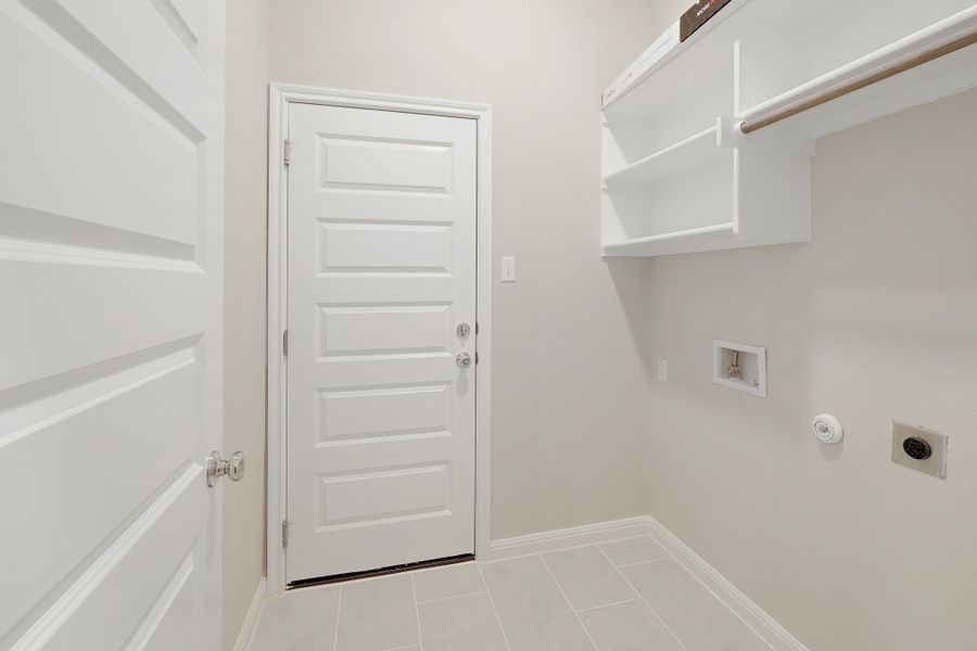 Utility Room in the Ash home plan by Trophy Signature Homes – REPRESENTATIVE PHOTO