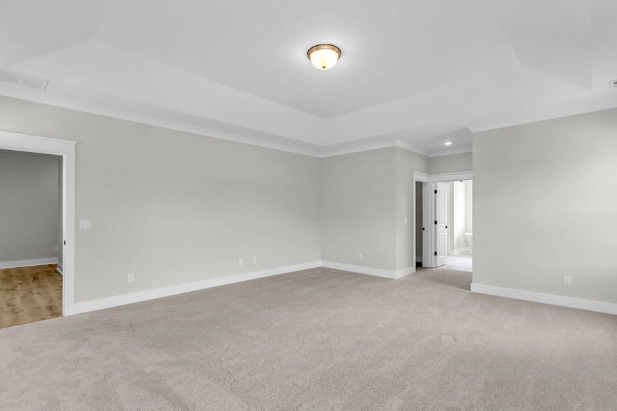 Spacious, unfurnished interior of a new home in Tidewater at Lakes of Cane Bay, Summerville (Image 45).