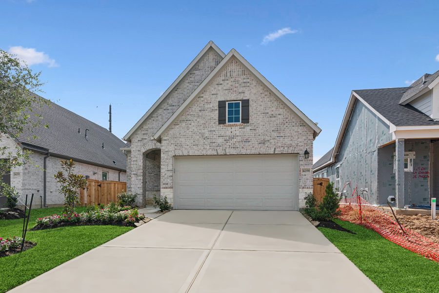 Front exterior of a new home in The Grand Prairie 40’, Hockley, TX, highlighting curb appeal (Image 20).