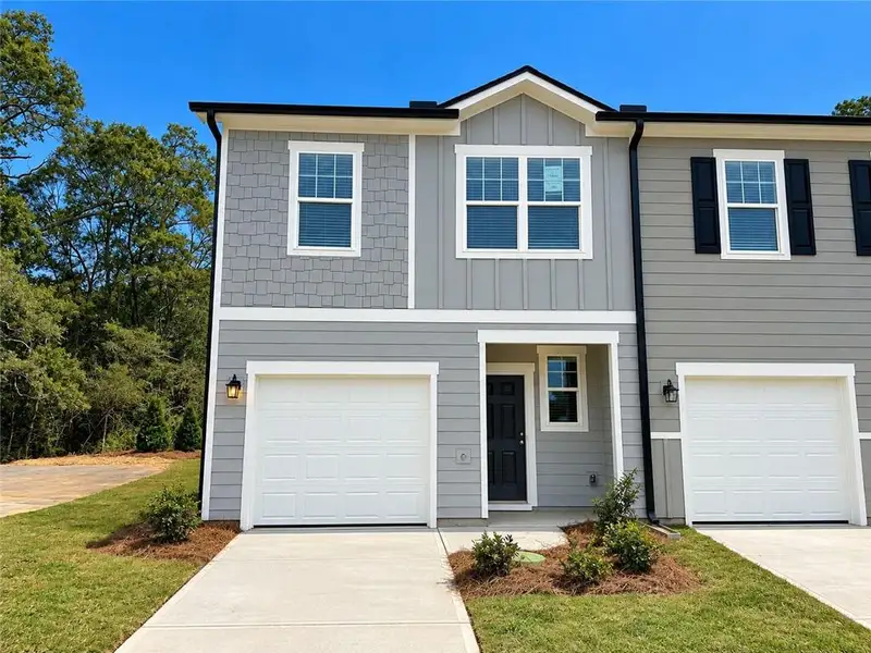 Front exterior of a new home in Villas at Cassville, Cartersville, GA, highlighting curb appeal (Image 1). Front exterior of a new home in Villas at Cassville, Cartersville, GA, highlighting curb appeal (Image 1).