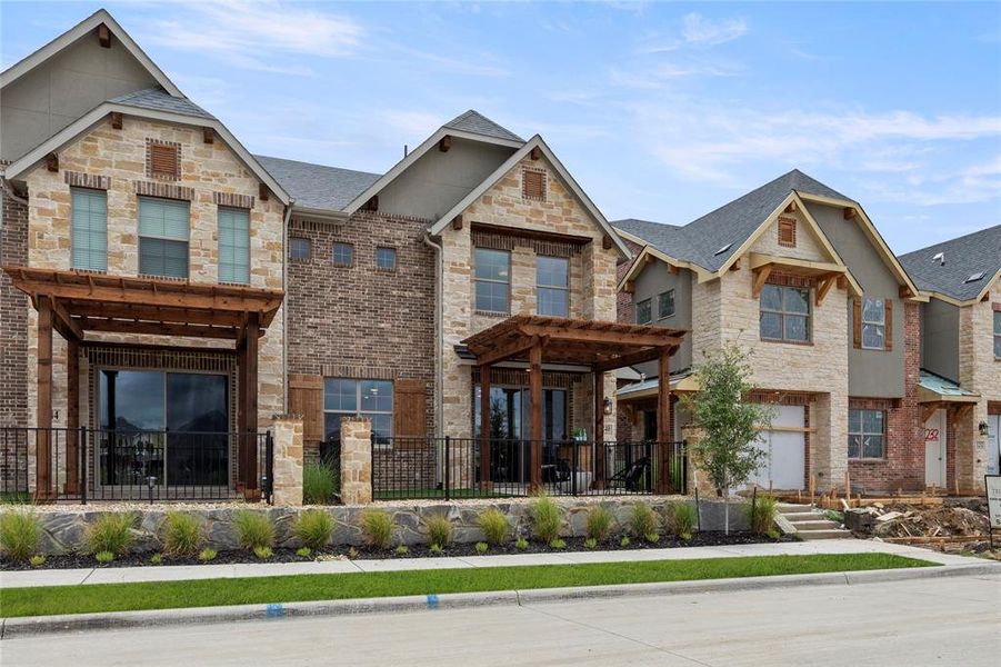 Front exterior of a new home in The Tribute, The Colony, TX, highlighting curb appeal (Image 21). Front exterior of a new home in The Tribute, The Colony, TX, highlighting curb appeal (Image 21).