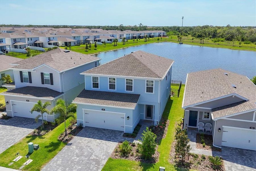 Front exterior of a new home in Avalon Woods, Lakewood Ranch, FL, highlighting curb appeal (Image 2). Front exterior of a new home in Avalon Woods, Lakewood Ranch, FL, highlighting curb appeal (Image 2).