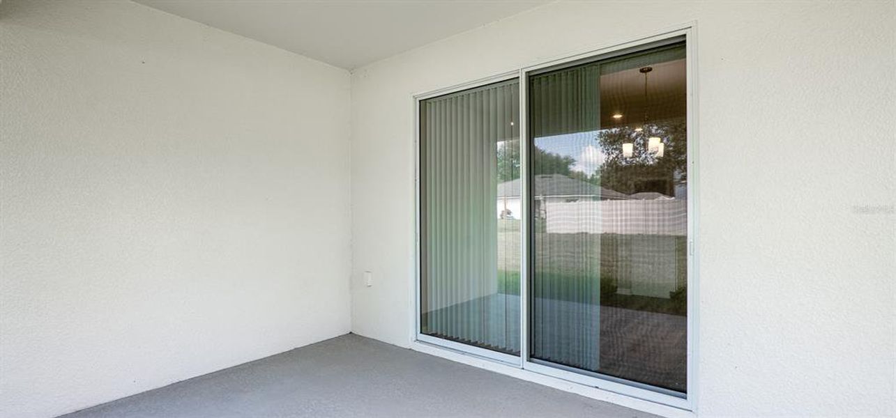 Exterior details and patio area of a home in Otter Woods Estates, Auburndale (Image 2).