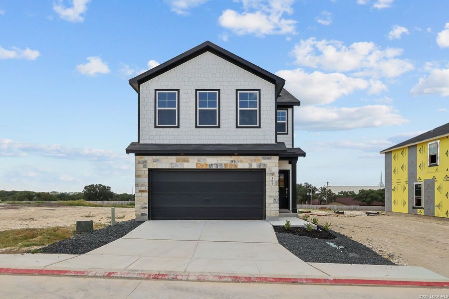 Front exterior of a new home in Meadows at Oak Creek, San Antonio, TX, highlighting curb appeal (Image 21). Front exterior of a new home in Meadows at Oak Creek, San Antonio, TX, highlighting curb appeal (Image 21).