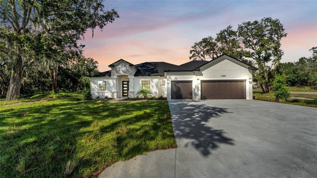 Front exterior of a new home in , Lakeland, FL, highlighting curb appeal (Image 24).