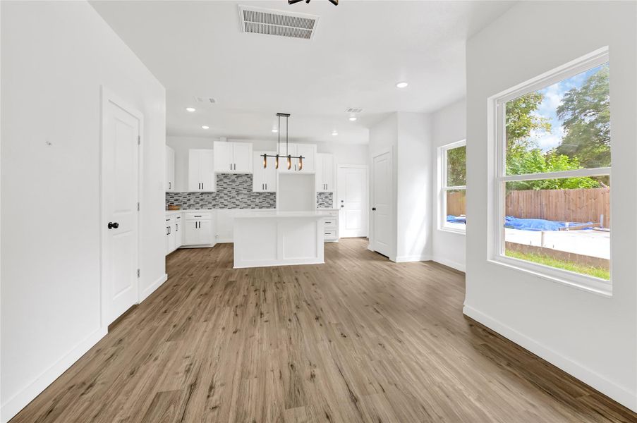 Bright, open entry with luxury vinyl plank flooring and high ceilings. Bright, open entry with luxury vinyl plank flooring and high ceilings.