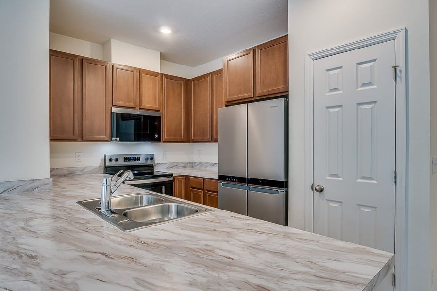 Furnished interior view inside a new home in Orchard Park Townhomes, St. Augustine (Image 5).