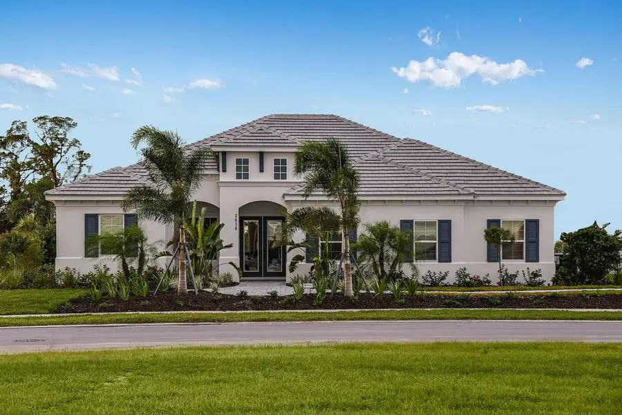 Front exterior of a new home in Windward, Lakewood Ranch, FL, highlighting curb appeal (Image 2).