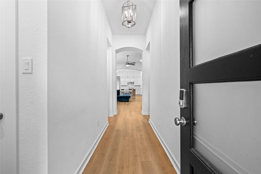 Step into this inviting foyer that gracefully leads to a bright and airy living room. Step into this inviting foyer that gracefully leads to a bright and airy living room.