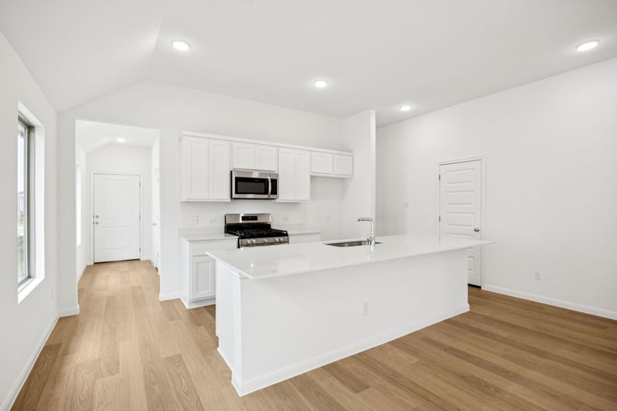 Kitchen in the Spruce home plan by Trophy Signature Homes - REPRESENTATIVE PHOTO
