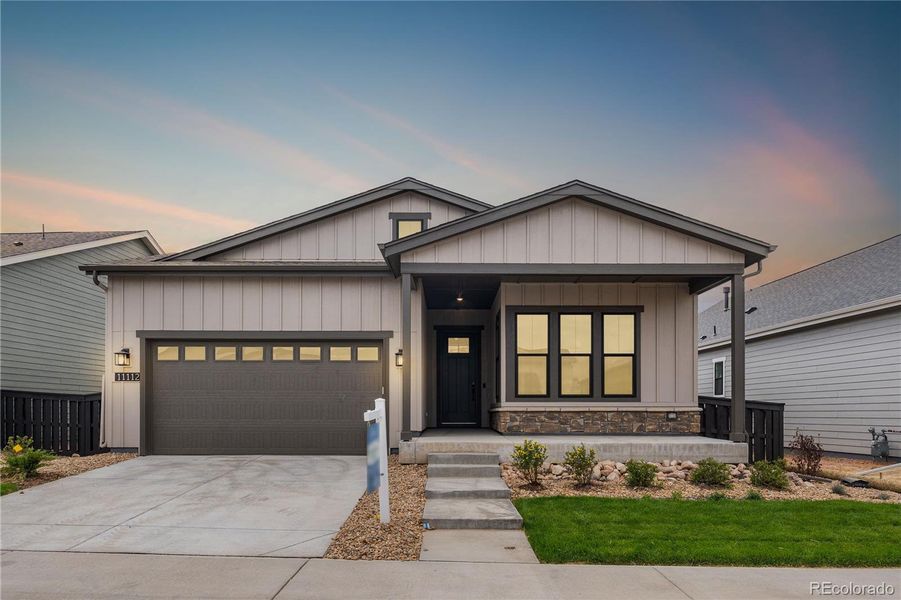Front exterior of a new home in Horizon at Solstice, Littleton, CO, highlighting curb appeal (Image 1).