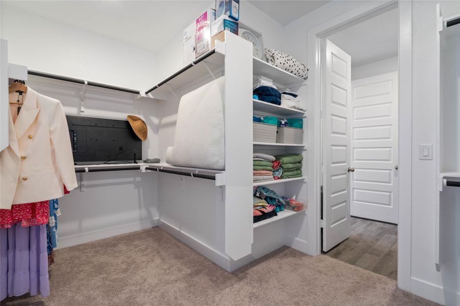The walk-in closet is sure to provide plenty of space for your wardrobe and accessories.