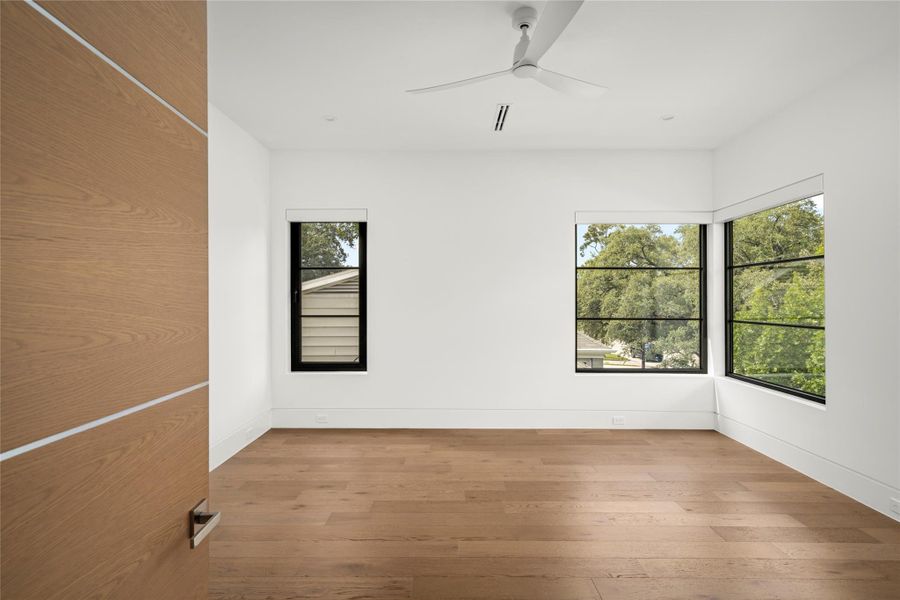 [Secondary Bedroom] Among the potential FIVE secondary bedrooms, each boasting its own ensuite bathroom. Enjoy recessed lighting, linear vents, ceiling fan, wide plank hardwood floors, and abundant natural light.