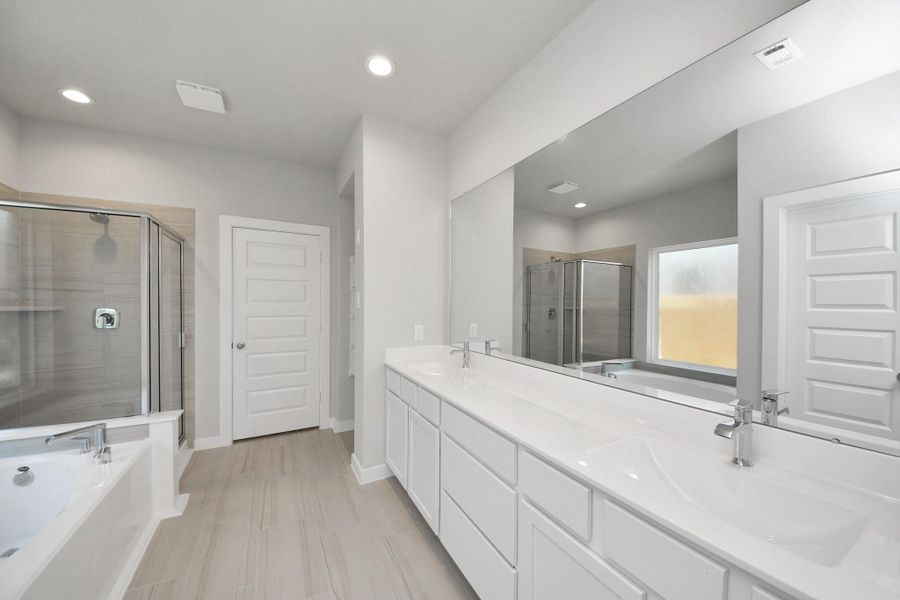 Indulge in a spa-like retreat within the confines of this primary bathroom. Sample photo of completed home with similar floor plan. Actual colors and selections may vary. Indulge in a spa-like retreat within the confines of this primary bathroom. Sample photo of completed home with similar floor plan. Actual colors and selections may vary.