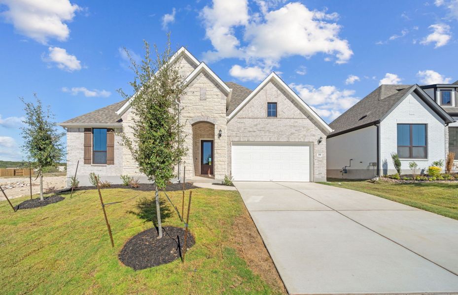 Front exterior of a new home in 6 Creeks, Kyle, TX, highlighting curb appeal (Image 1). Front exterior of a new home in 6 Creeks, Kyle, TX, highlighting curb appeal (Image 1).