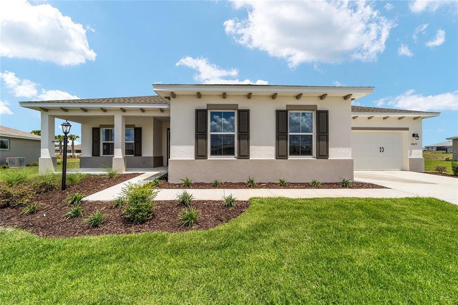 Front exterior of a new home in , Ocala, FL, highlighting curb appeal (Image 2). Front exterior of a new home in , Ocala, FL, highlighting curb appeal (Image 2).