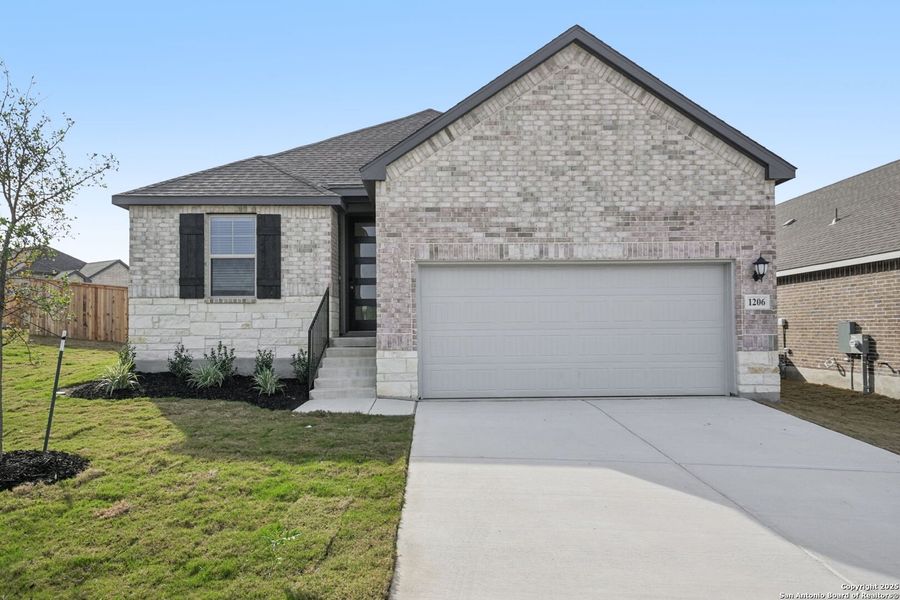 Front exterior of a new home in Arcadia Ridge - Premier Series, San Antonio, TX, highlighting curb appeal (Image 2). Front exterior of a new home in Arcadia Ridge - Premier Series, San Antonio, TX, highlighting curb appeal (Image 2).