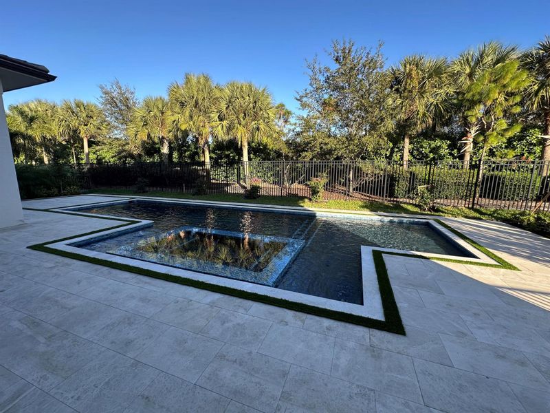 Exterior details and patio area of a home in Coral Isles at Avenir, Palm Beach Gardens (Image 10).
