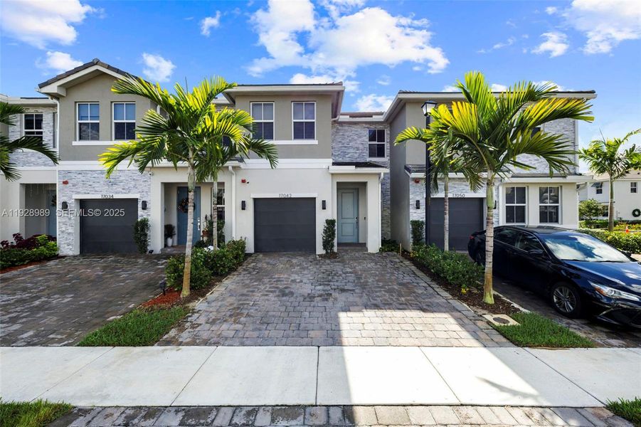 Front exterior of a new home in , Pembroke Pines, FL, highlighting curb appeal (Image 1). Front exterior of a new home in , Pembroke Pines, FL, highlighting curb appeal (Image 1).