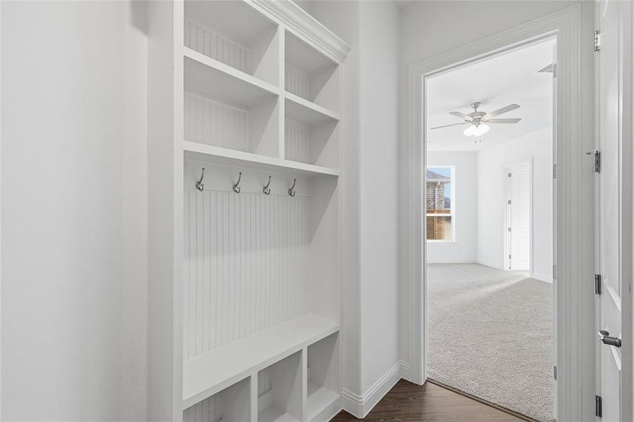 Mudroom featuring dark wood-style floors and a ceiling fan