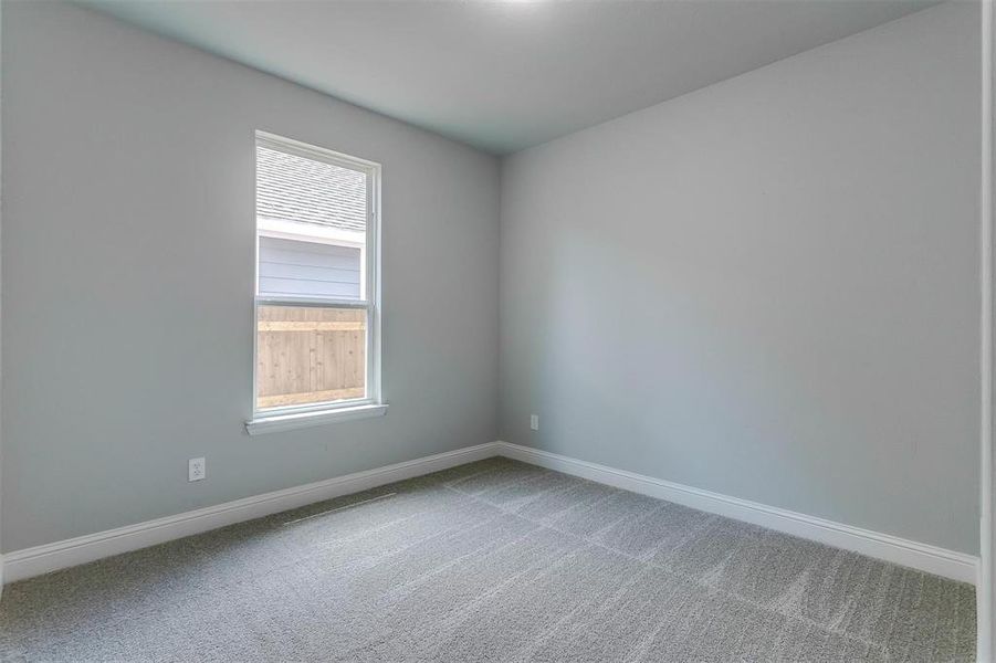 Empty room with carpet floors