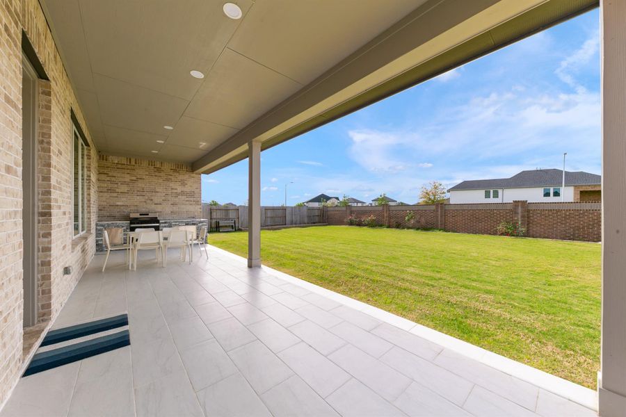 The spacious backyard offers plenty of room for outdoor entertaining while maintaining privacy with no immediate rear neighbors.