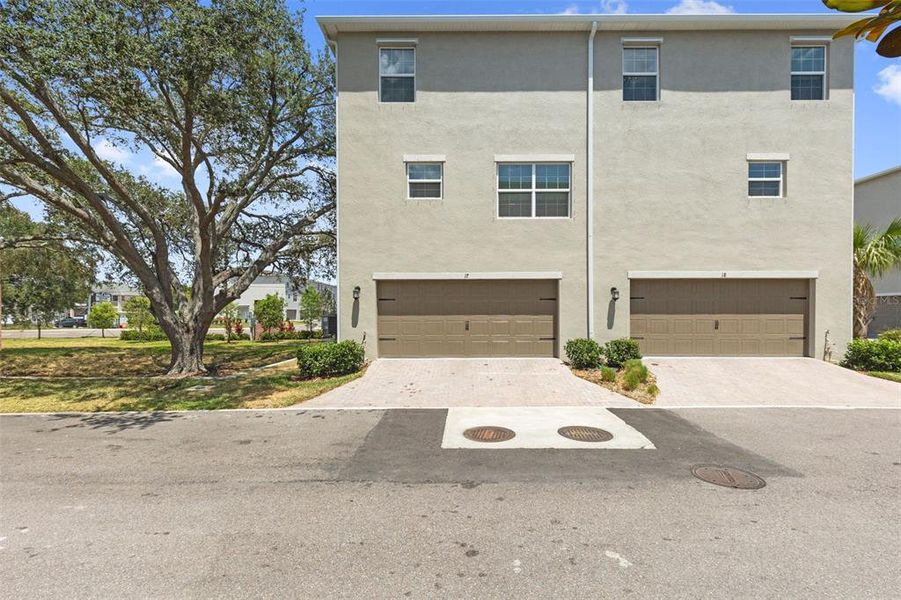 Front exterior of a new home in Townes at Manhattan Crossing, Tampa, FL, highlighting curb appeal (Image 2).
