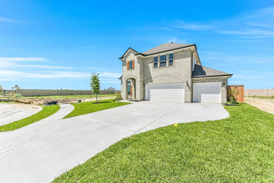 Front exterior of a new home in River Ranch Meadows, Dayton, TX, highlighting curb appeal (Image 24).