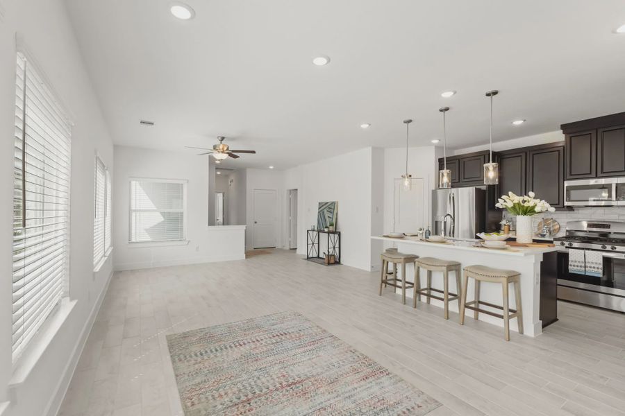 Representative furnished interior of a home built from the Chalet by Chesmar Homes in Meridiana Townhomes, Iowa Colony (Image 12).