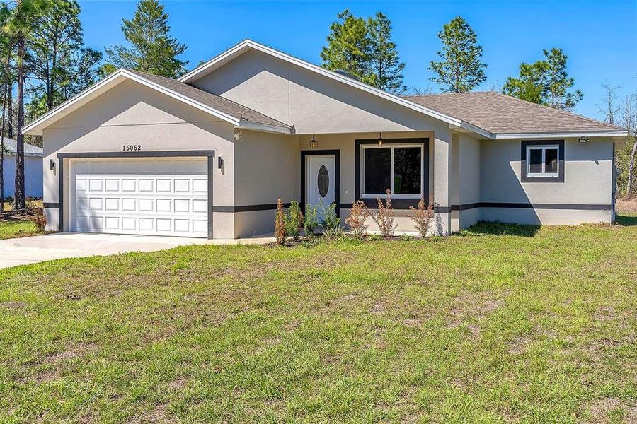 Front exterior of a new home in , Ocala, FL, highlighting curb appeal (Image 2).