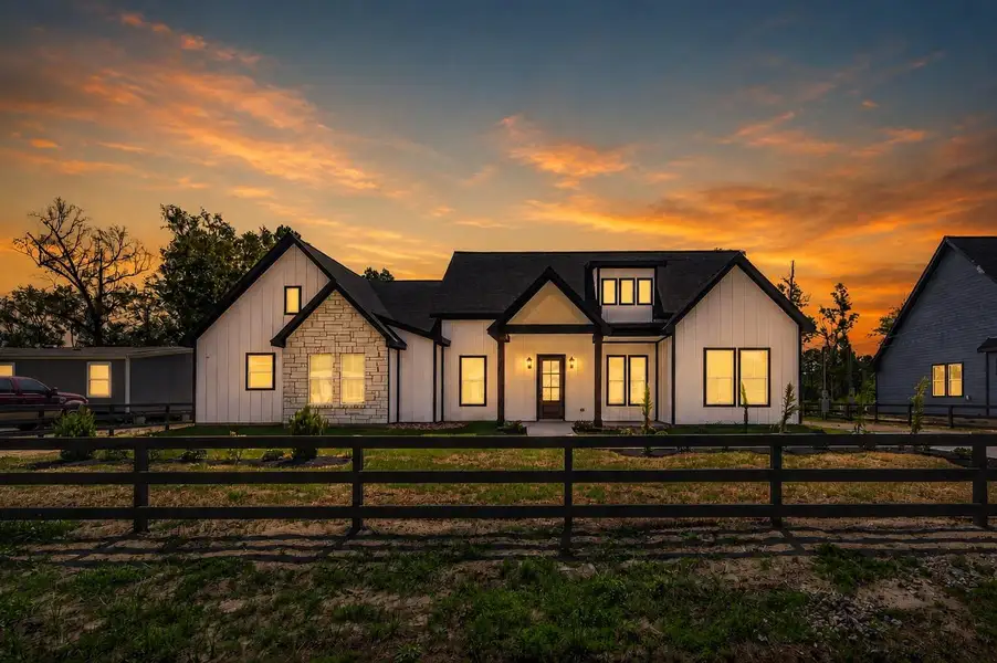 Beautiful custom modern farmhouse situated on a spacious ½-acre lot with fresh landscaping and welcoming curb appeal.