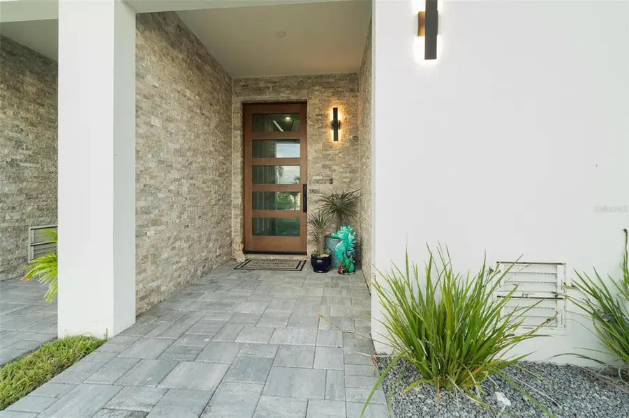 Exterior details and patio area of a home in , Madeira Beach (Image 28).