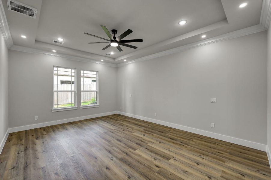 The primary suite/owner’s retreat offers a peaceful escape with views of the backyard. The primary suite/owner’s retreat offers a peaceful escape with views of the backyard.