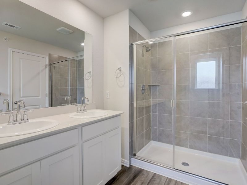 Live in luxury with the primary bathroom and closet.