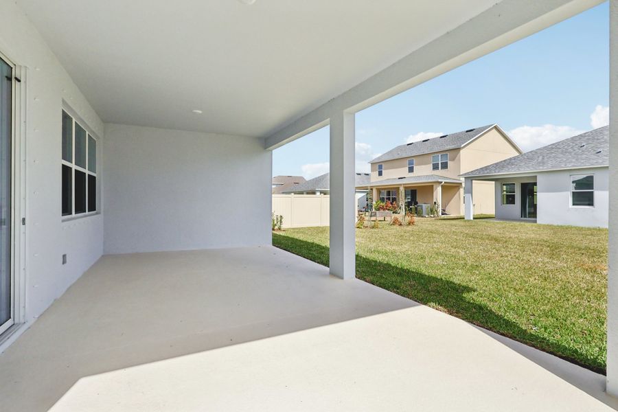 Exterior details and patio area of a home in St. Johns Preserve, Palm Bay (Image 2).