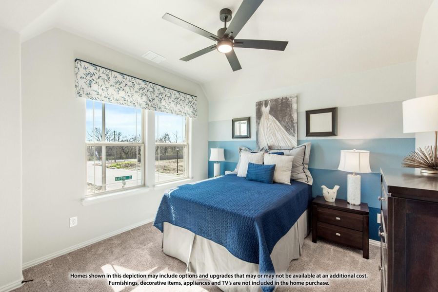 Bedroom with blue accent wall, ceiling fan, carpet flooring, and double windows with decorative valance
