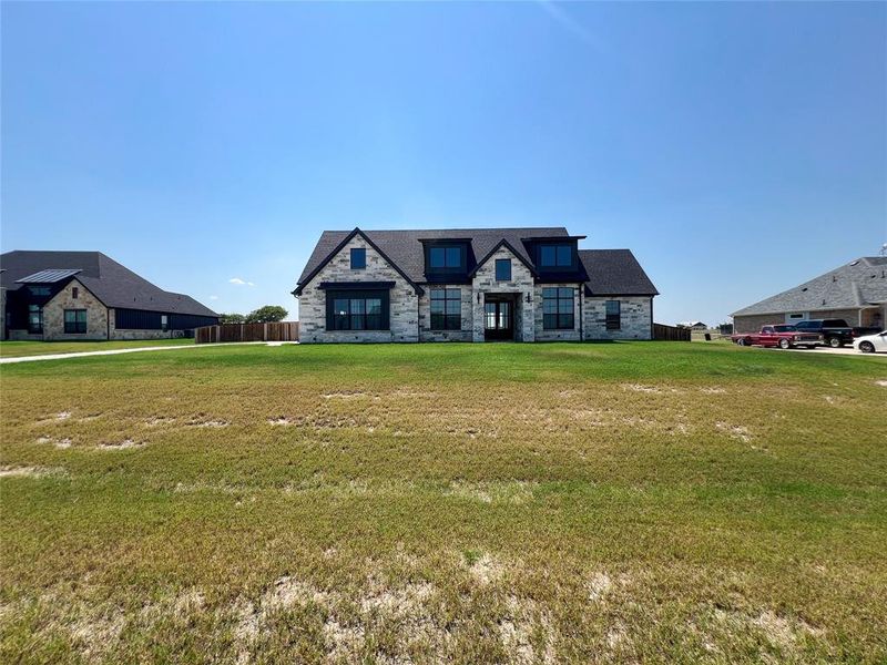 View of front of home featuring stone siding