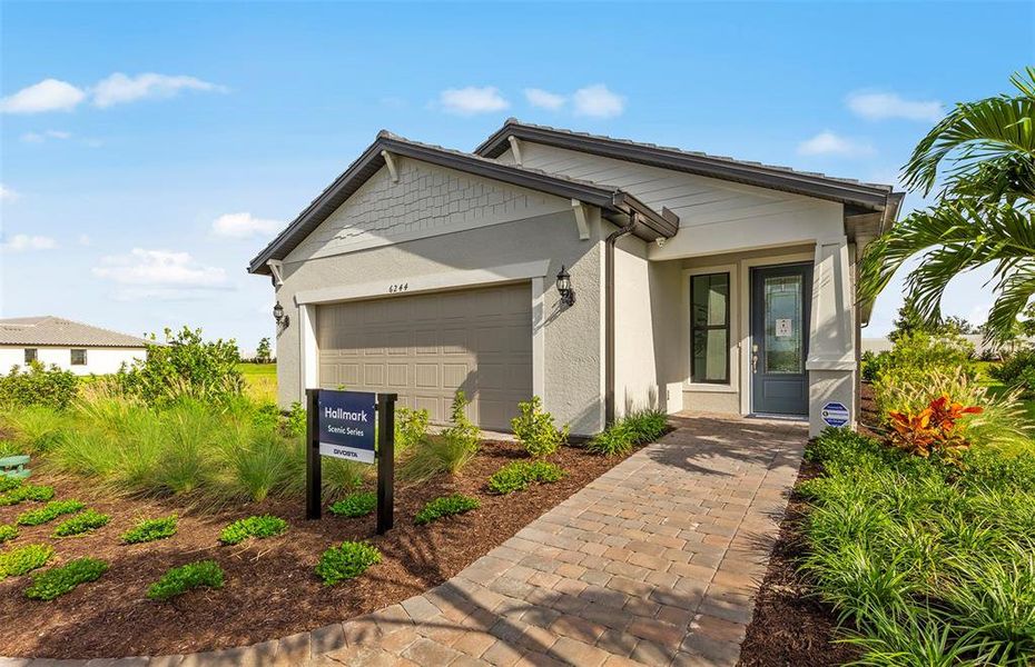 Front exterior of a new home in SeaFlower, Bradenton, FL, highlighting curb appeal (Image 1). Front exterior of a new home in SeaFlower, Bradenton, FL, highlighting curb appeal (Image 1).