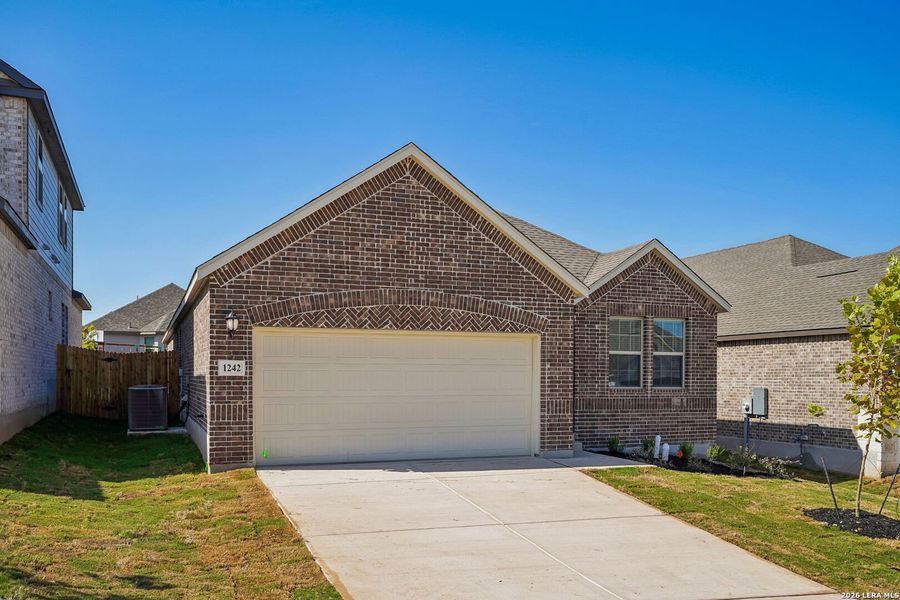 Front exterior of a new home in Arcadia Ridge - Premier Series, San Antonio, TX, highlighting curb appeal (Image 22). Front exterior of a new home in Arcadia Ridge - Premier Series, San Antonio, TX, highlighting curb appeal (Image 22).