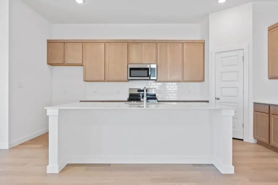 Kitchen in the Quartz home plan by Trophy Signature Homes – REPRESENTATIVE PHOTO Kitchen in the Quartz home plan by Trophy Signature Homes – REPRESENTATIVE PHOTO