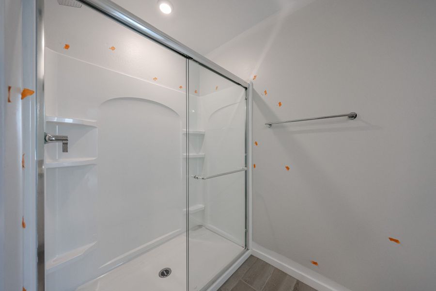 A shower with a glass door. A shower with a glass door.