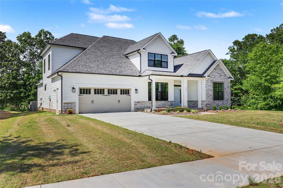 Front exterior of a new home in , Mint Hill, NC, highlighting curb appeal (Image 17).