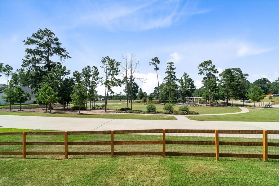 Across the street from 551 Black Bronco Road is the community lake and walking trails.