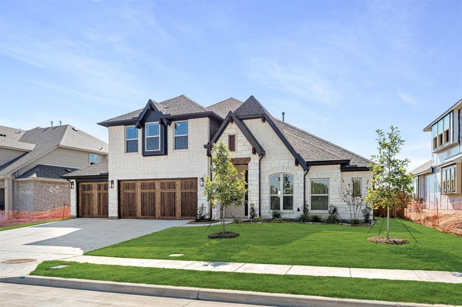 Front exterior of a new home in Stone River Glen 60s, Royse City, TX, highlighting curb appeal (Image 2). Front exterior of a new home in Stone River Glen 60s, Royse City, TX, highlighting curb appeal (Image 2).