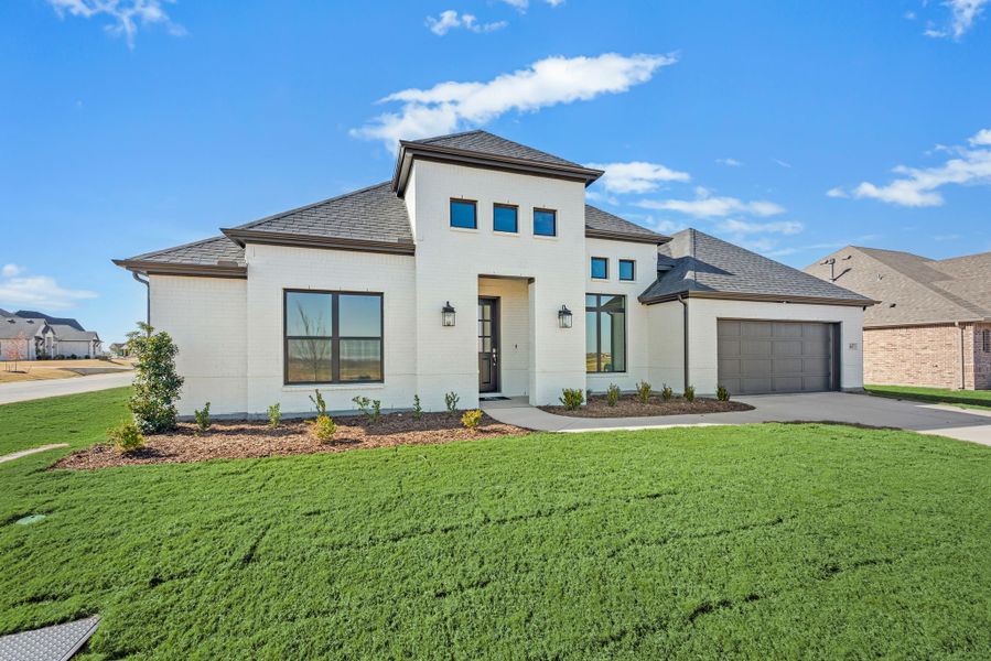 Front exterior of a new home in Settlers Glen, New Fairview, TX, highlighting curb appeal (Image 1). Front exterior of a new home in Settlers Glen, New Fairview, TX, highlighting curb appeal (Image 1).