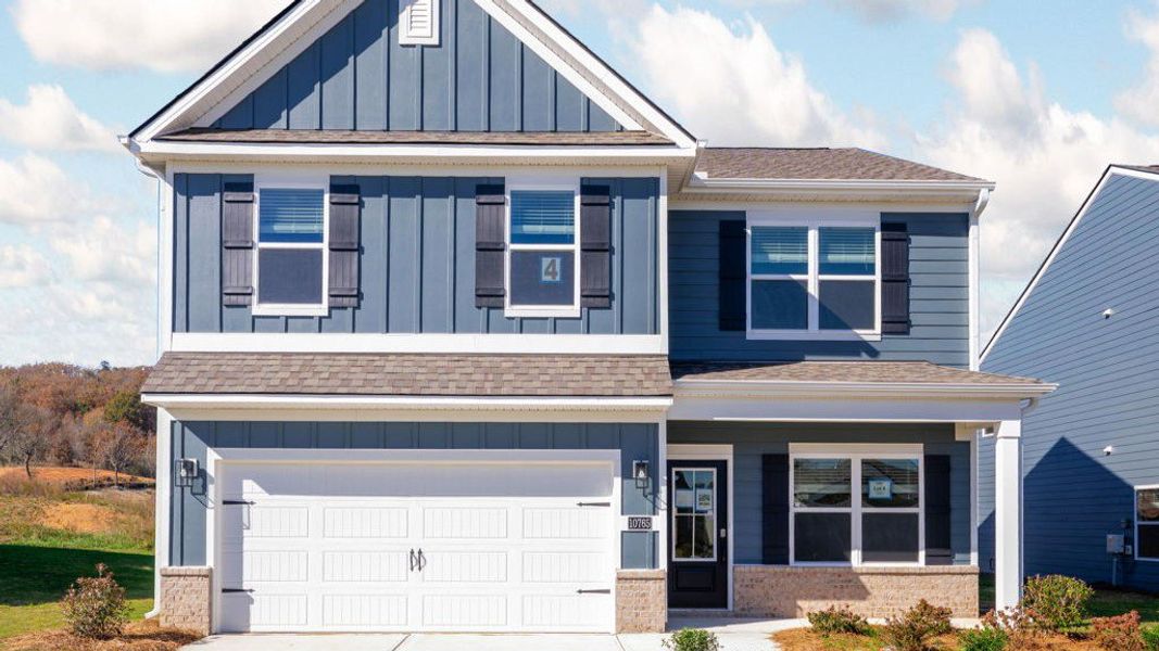 Front exterior of a new home in Prairie Pass, Apison, TN, highlighting curb appeal (Image 16). Front exterior of a new home in Prairie Pass, Apison, TN, highlighting curb appeal (Image 16).