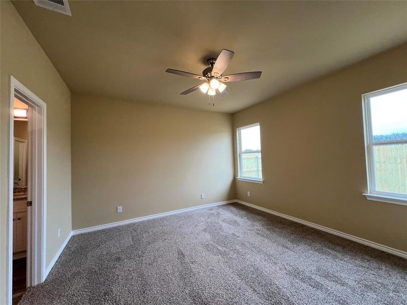 Primary Carpeted Bedroom with Ensuite Bath