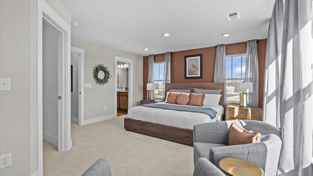 Vibrant natural light fills this exceptional primary suite with eye-catching details located near Downtown Greenville